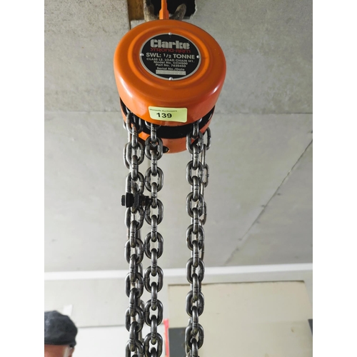 139 - A Clarke 1/2 tonne strong arm ceiling winch and chain.