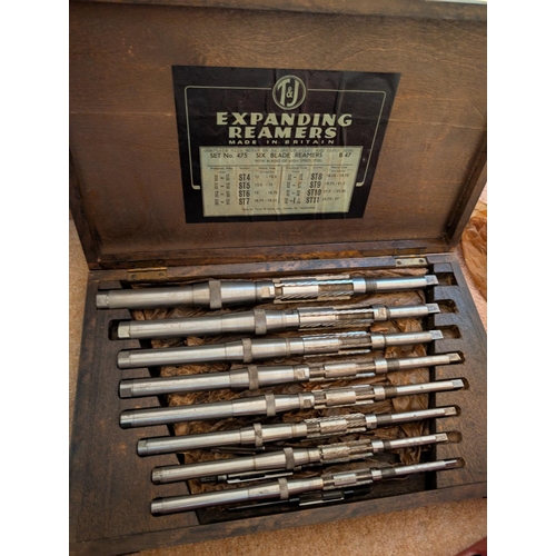 14 - A cased T&J expanding reamers set, graduating in size.