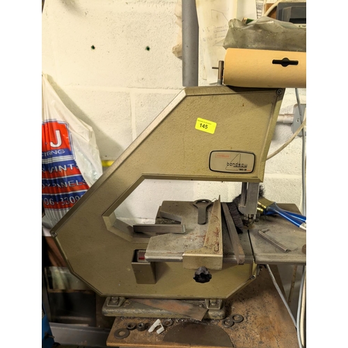 145 - A Powerline bandsaw BBS-20 and spares.