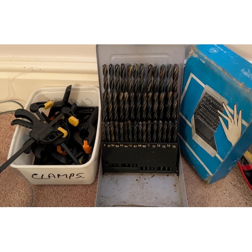 19 - A large 41-piece drill bit set and selection of clamps.