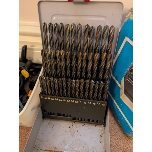 19 - A large 41-piece drill bit set and selection of clamps.