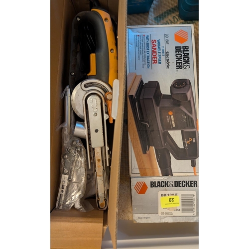 29 - A Black and Decker variable speed sander and an Evolution grinder sander, both in boxes.