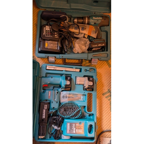 30 - A cased Makita replicating saw and a case Makita drill.