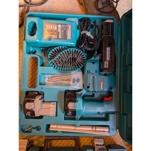 30 - A cased Makita replicating saw and a case Makita drill.