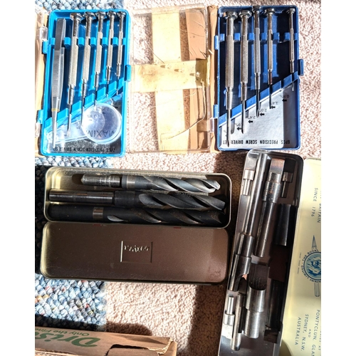 39 - Precision screw drivers, two cased sets (one missing) and metal drill bits, larger sizes.