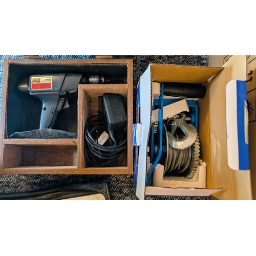 42 - A hand winch 2500lb/1134kg in box and a cordless drill.