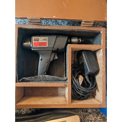 42 - A hand winch 2500lb/1134kg in box and a cordless drill.