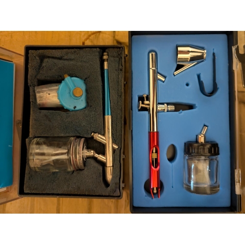 66 - Two cased airbrushes, top and bottom loading, gauges etc, one Badger airbrush model 200-EX