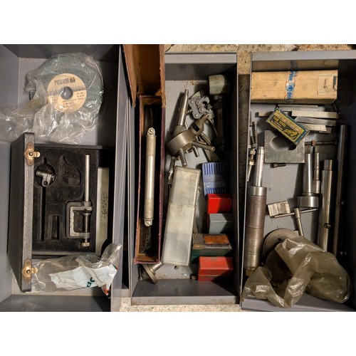 147 - A workshop cabinet containing five sets of letter punches, Stanley plane etc.