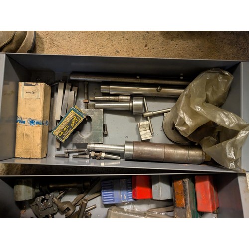 147 - A workshop cabinet containing five sets of letter punches, Stanley plane etc.