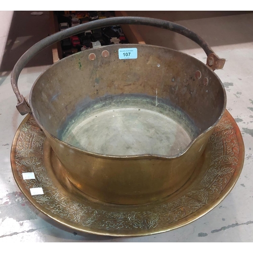 107 - A 19th century Jam Pan and an Islamic brass tray, 7kg.