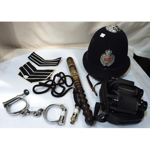 123 - A Police truncheon commemorating the General Strike May 1926; a vintage Police helmet, handcuffs, wh... 