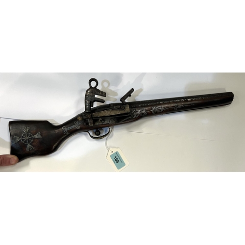 169 - A display flintlock rifle wity older flintlock firing mechanism and inlaid stock, later brass and ot... 