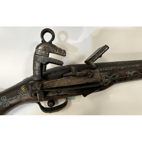 169 - A display flintlock rifle wity older flintlock firing mechanism and inlaid stock, later brass and ot... 