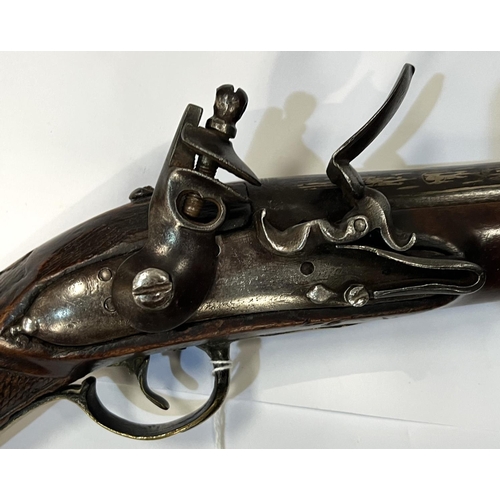 174 - A possibly Turkish? blunderbuss flintlock long pistol with silvered barrel, brass fittings and hatch... 