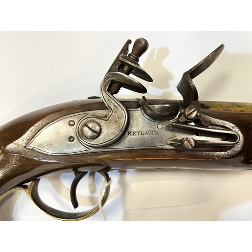 180 - A reproduction flintlock pistol with double cocking movement, lock plate stamped Ketland, with brass... 