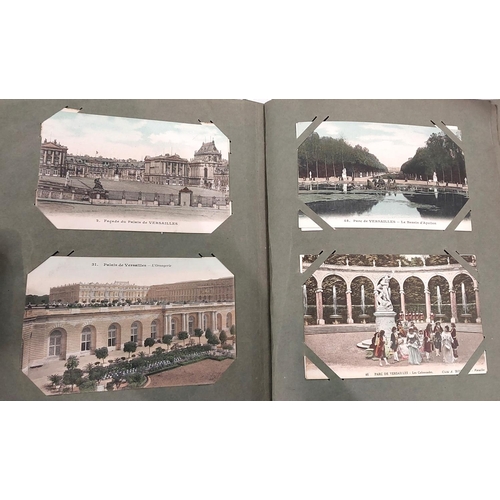 205 - A large early 20th century postcard album with WWI silk postcards of post WWI ruins, historical and ... 