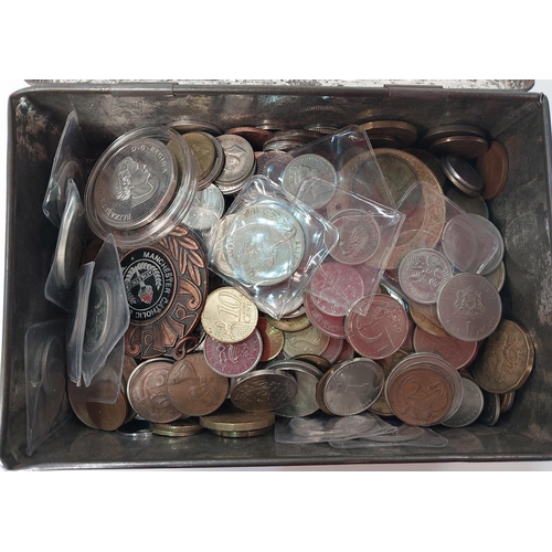 351 - An album of foreign coins and tokens and a quantity of coins in a tin.