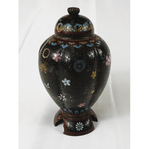 412 - A Japanese Meiji period lobed Cloisonne lidded vase with three feet under, floral decoration. Height... 