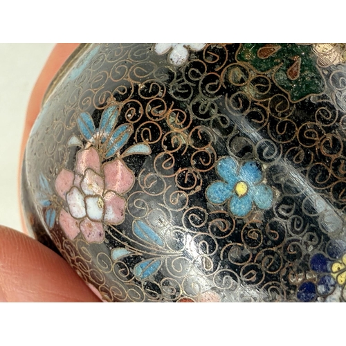 412 - A Japanese Meiji period lobed Cloisonne lidded vase with three feet under, floral decoration. Height... 