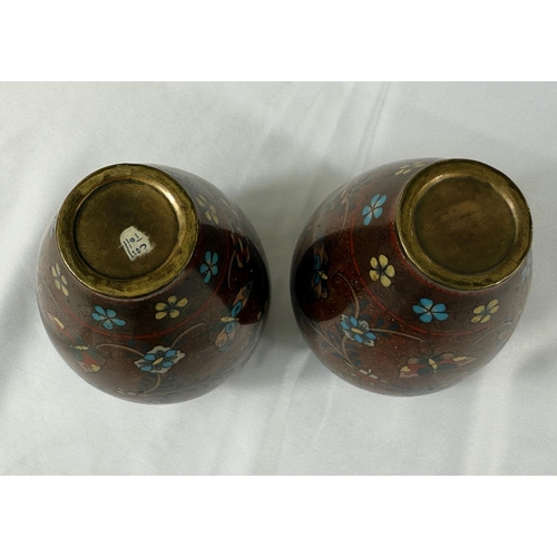 413 - A pair of Japanese Meiji period rust ground Cloisonne vases with scrolling branch and butterfly deco... 