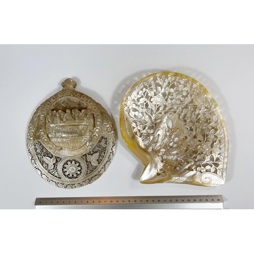 421 - An oriental extensively carved and pierced mother of pearl shell depicting the Last Supper, length 2... 