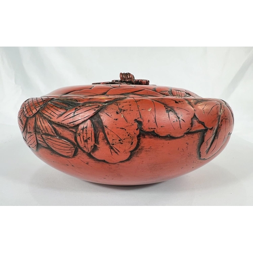 429 - A large 19th Century Chinese cinnabar lacquer covered bowl with leaves in relief, bearing Sainsbury'... 