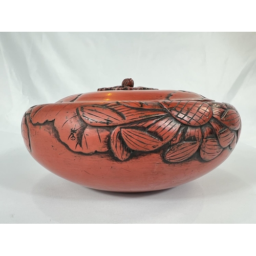 429 - A large 19th Century Chinese cinnabar lacquer covered bowl with leaves in relief, bearing Sainsbury'... 