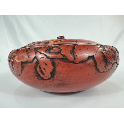 429 - A large 19th Century Chinese cinnabar lacquer covered bowl with leaves in relief, bearing Sainsbury'... 