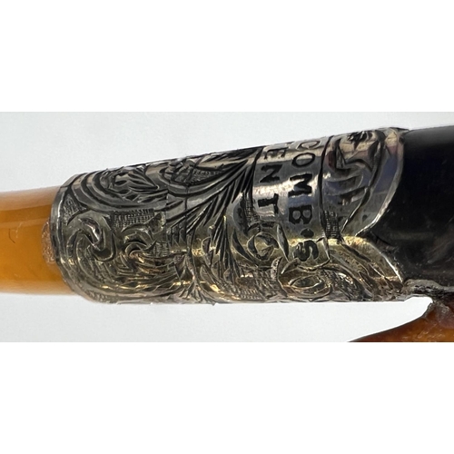 43 - An unusual cased pair of amber and Meerschaum pipes, one depicting a naked woman, the other an eagle... 