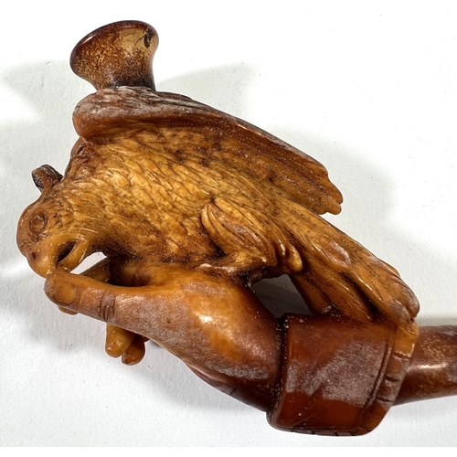 43 - An unusual cased pair of amber and Meerschaum pipes, one depicting a naked woman, the other an eagle... 