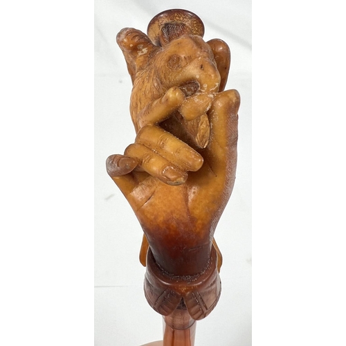 43 - An unusual cased pair of amber and Meerschaum pipes, one depicting a naked woman, the other an eagle... 