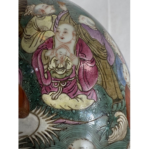 434 - A Chinese Famille Rose lidded bowl with extensive polychrome decoration with deities, birds, crabs, ... 