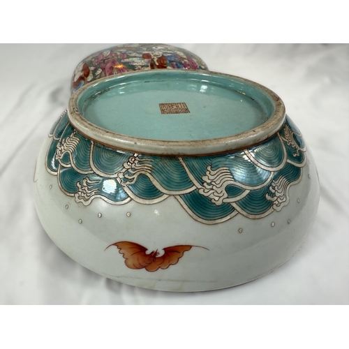 434 - A Chinese Famille Rose lidded bowl with extensive polychrome decoration with deities, birds, crabs, ... 