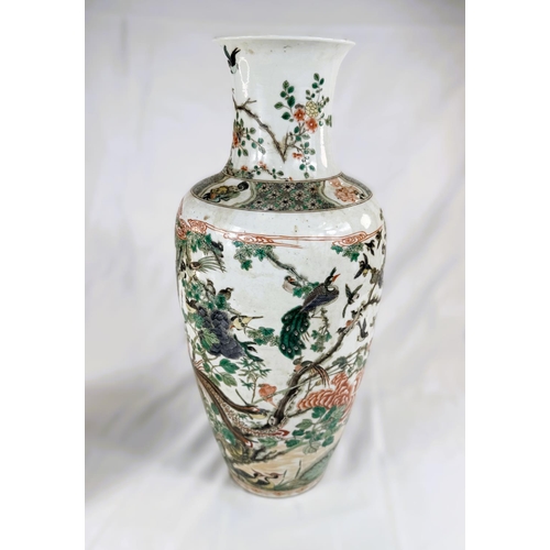 434B - A Chinese Famille Verte vase with polychrome decoration of birds on branches, height 44cm.