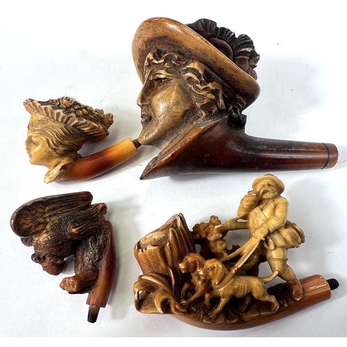 44 - 4 Meerschaum pipe bowls, 2 depicting women's heads, man walking dogs and an eagle on a rock (one wit... 