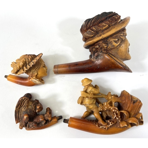 44 - 4 Meerschaum pipe bowls, 2 depicting women's heads, man walking dogs and an eagle on a rock (one wit... 