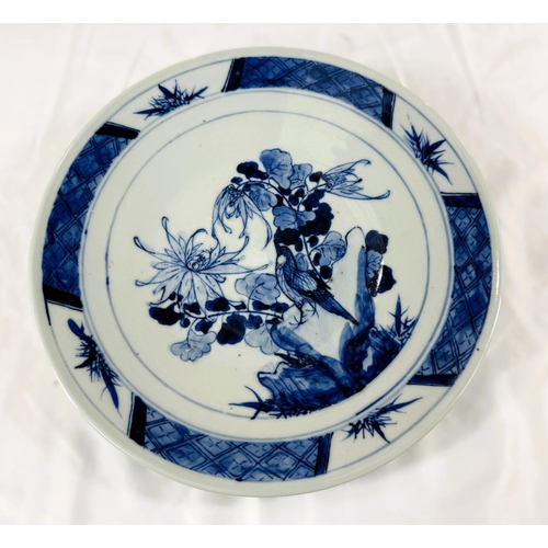 442 - A late 19th Century Chinese blue and white ceramic dish with bird on flowers, diameter 27cm.