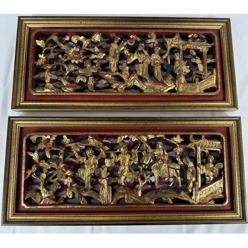 443 - A pair of late 19th/early 20th Century Chinese gilt wooden wall panels with figures, 15.5x34.5cm