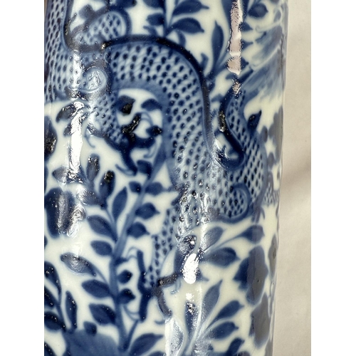 449 - A large Chinese 19th Century blue and white cylindrical dragon vase with four character mark to base... 