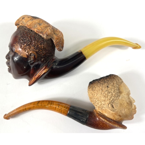 45 - 2 cased amber and Meerschaum pipes depicting black boys heads.