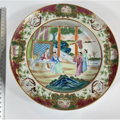 451 - A Chinese 19th Century Famille Rose shallow dish with polychrome decoration of domestic scene. Diame... 