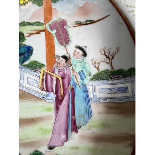 451 - A Chinese 19th Century Famille Rose shallow dish with polychrome decoration of domestic scene. Diame... 