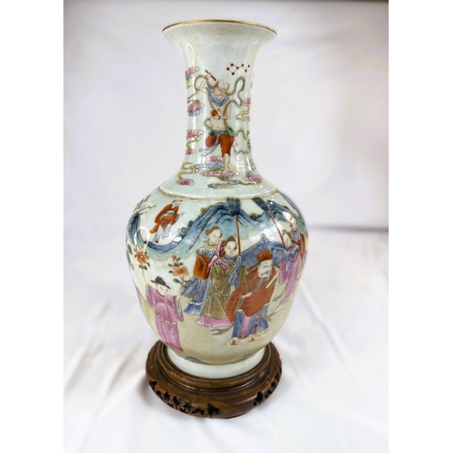 456 - A Chinese Famille Rose vase decorated with polychrome figures of people collecting flowers, with sea... 