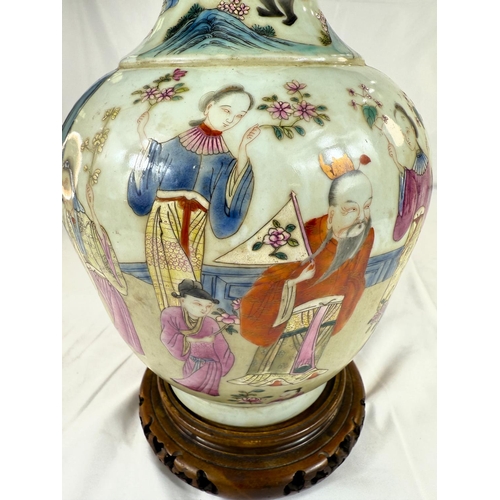 456 - A Chinese Famille Rose vase decorated with polychrome figures of people collecting flowers, with sea... 