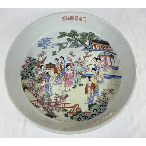 458 - A large and impressive Chinese shallow bowl with polychrome decoration of traditional courtyard scen... 