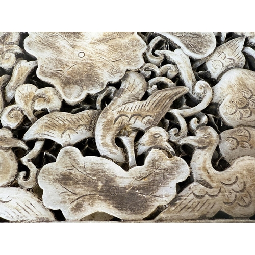 458B - A Chinese hardwood box with a pierced stone carving to the lid with birds and leaves. 16 1/2 x 14 x ... 