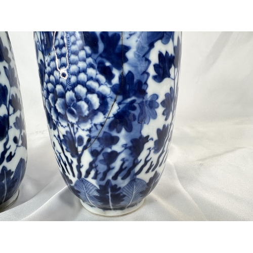 463 - A pair of Chinese 18th/19th Century lidded vases with marks for Kangxi period, blue and white with b... 