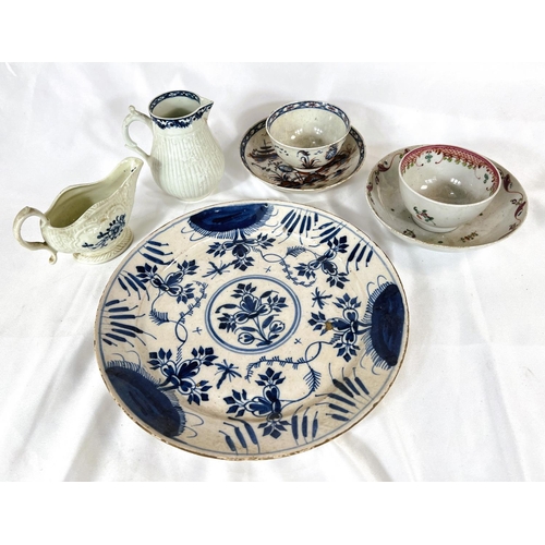 464 - An early tin glaze blue and white dish, two English porcelain tea bowls and dishes and two early Eng... 