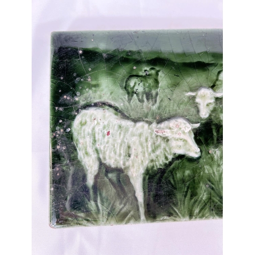 464A - A 19th Century Minton's style green glaze tile of Shepherd playing instrument for sheep 15 x 46cm